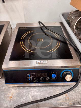 henGzhi IC-35A induction cooker with digital controls, visible logo, used condition, stainless steel and black finish.