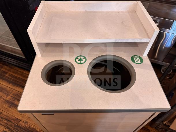 Recycling and waste receptacle with two labeled compartments and upper shelf, beige finish, ideal for sorting trash and recyclables.