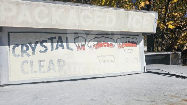 Outdoor single solid-door ice merchandiser, weathered condition, labeled "Crystal Clear."