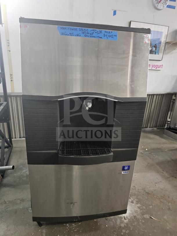 Manitowoc SPA310 ice dispenser, 180-lb storage, stainless steel finish, model details on label, used condition.