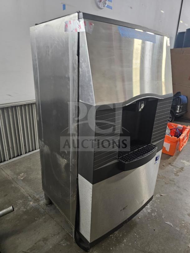 Manitowoc SPA310 ice dispenser with 180-lb storage, stainless steel, used condition, visible scuffs on exterior.