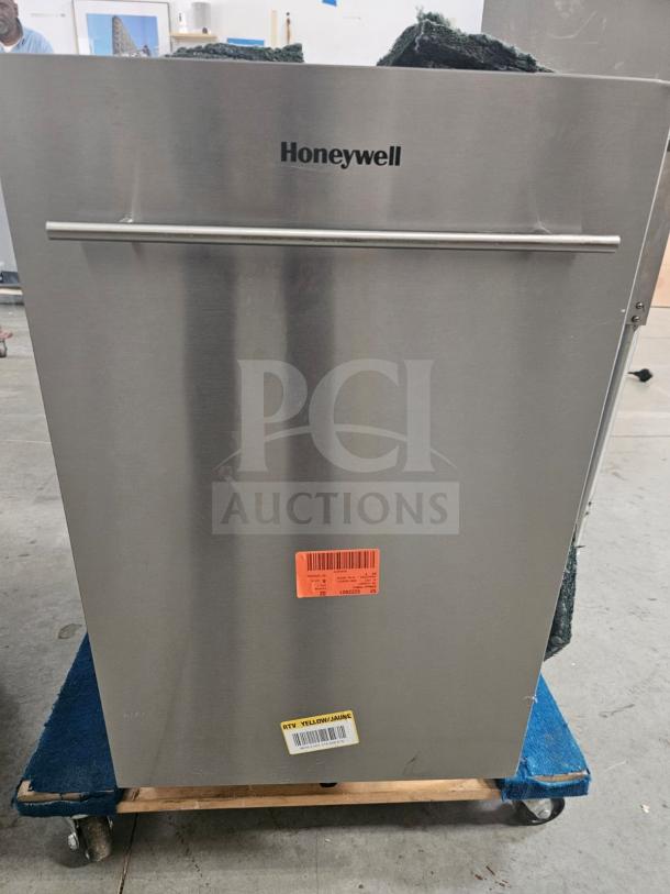 Stainless steel Honeywell residential dishwasher with handle, visible labels indicating item codes. New condition.
