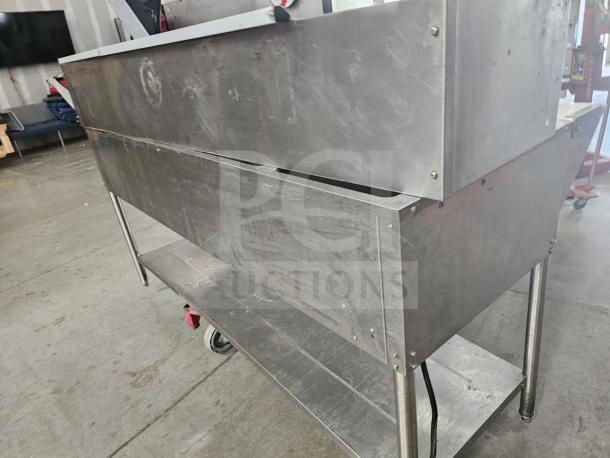AVATCO 177STE5S 5-pan open well electric steam table, stainless steel, visible wear, industrial setting.