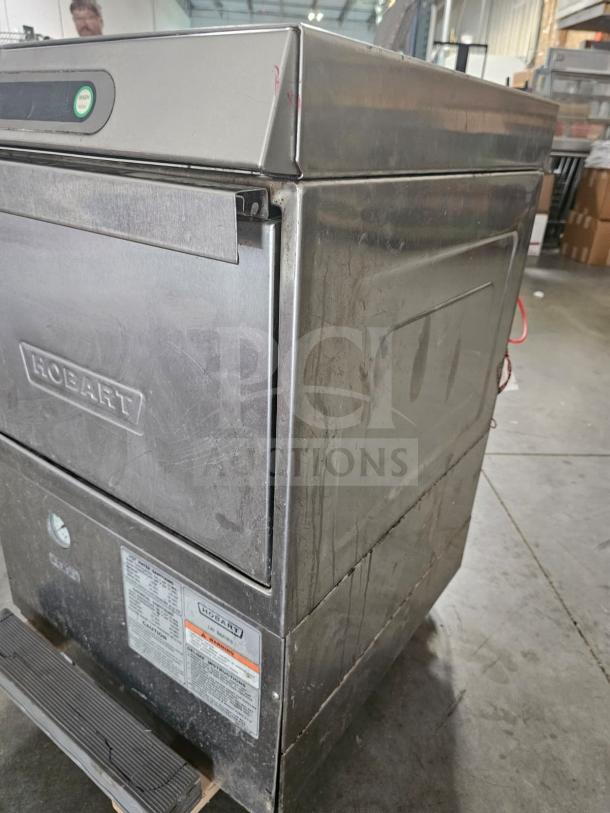 Hobart XLI commercial undercounter dishwasher, stainless steel, visible controls, sturdy build, moderate wear, branded label.