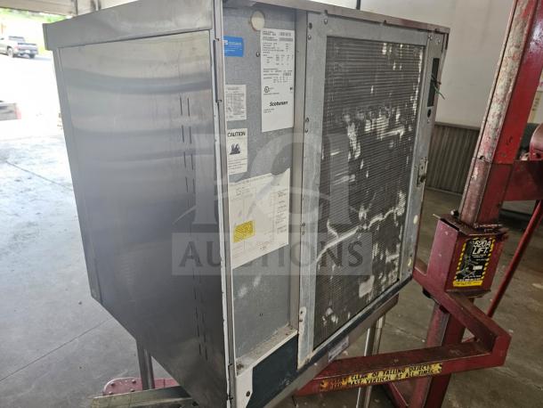 Scotsman Prodigy Series C0830SA-32B ice machine, modular cuber head. Used condition, visible labels and markings, industrial setting.