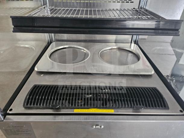 Omcan RS-CN-0250 open refrigerated display case, stainless steel, glass sides, dual circular display wells, good condition.