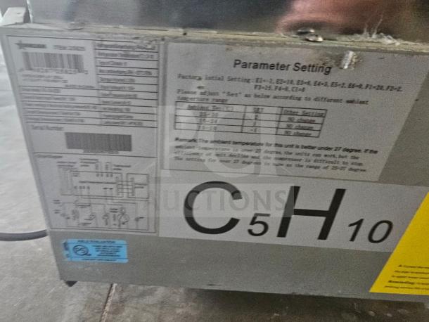 Omcan RS-CN-0250 open refrigerated display case tag, showing parameter settings and serial number details.