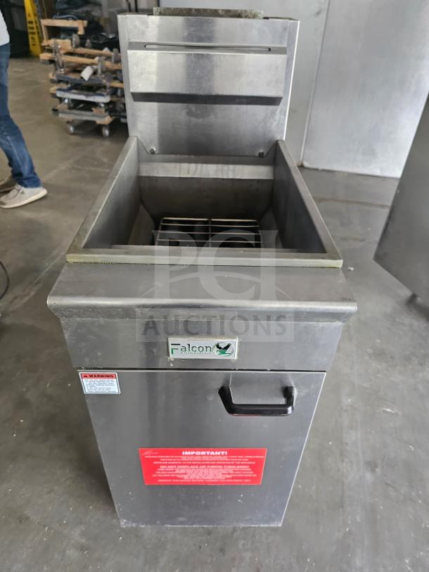 Commercial Falcon AF-90 gas fryer, 40-50 lbs capacity. Stainless steel exterior, open lid, safety and instruction labels visible.
