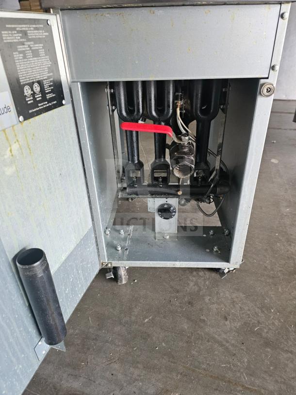 Commercial Falcon AF-90 gas fryer, 40-50 lbs capacity, open access showing heating elements, condition: used, visible model label.