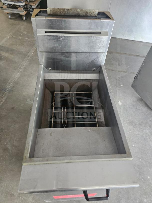 Commercial Falcon AF-90 gas fryer, 40-50 lbs. capacity, stainless steel, used, visible wear, ideal for high-volume frying.