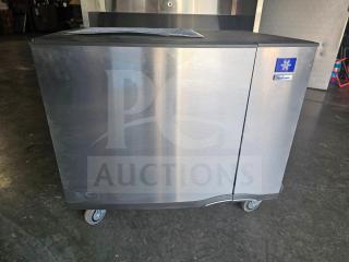 Manitowoc SD0452A commercial ice machine, stainless steel, 115V, on wheels, good condition, visible branding on front.