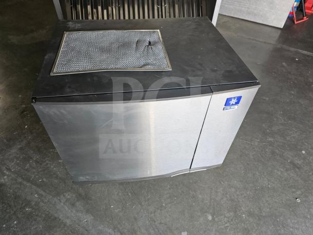 Manitowoc SD0452A commercial ice machine, stainless steel finish, 115V, good condition with ventilation panel on top.
