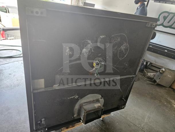 Commercial stainless steel exhaust hood, model XBEW-48.00-S, shown in used condition with wiring and mounting points visible.