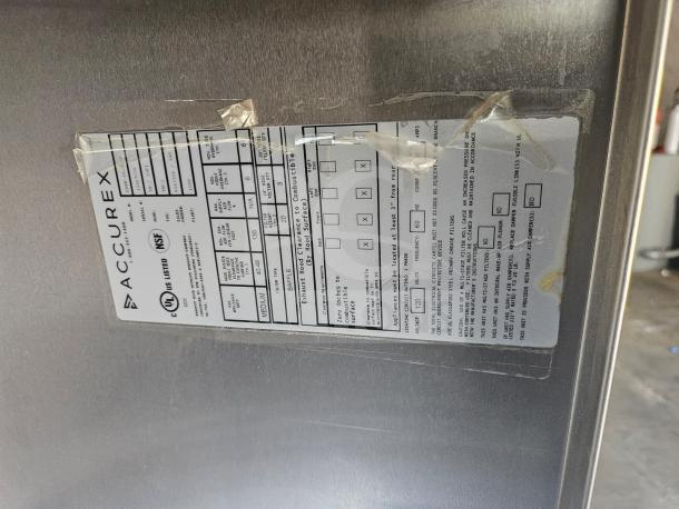 Commercial stainless steel exhaust hood, Accurex XBEW-48.00-S, UL and NSF listed, visible label showing model and specifications.