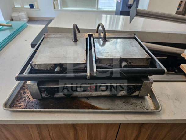 Nuova Simonelli Super Grill Commercial Double-bay panini grill, metal exterior, dual controls, used condition, visible wear.