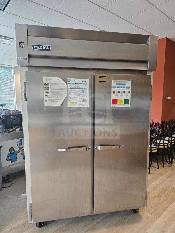 McCall 7-7045FT 2-door commercial freezer in stainless steel, features temperature gauge and exterior signage, used condition.