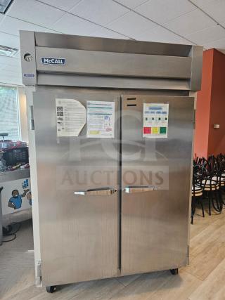 McCall 7-7045FT 2-door commercial freezer in stainless steel, features temperature gauge and exterior signage, used condition.