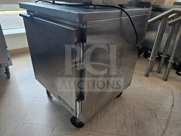 Beverage-Air WTR27A undercounter refrigerator, 27", 1 solid door, stainless steel, visible wear, on casters.