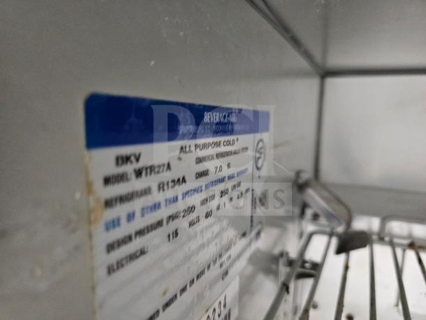 Beverage-Air WTR27A undercounter refrigerator label showing model, refrigerant type R134A, and specifications.