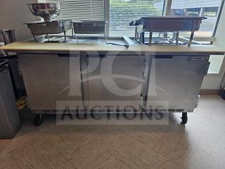 Beverage-Air 72" refrigerated salad bar with stainless steel finish, three doors, caster wheels, and visible branding label.