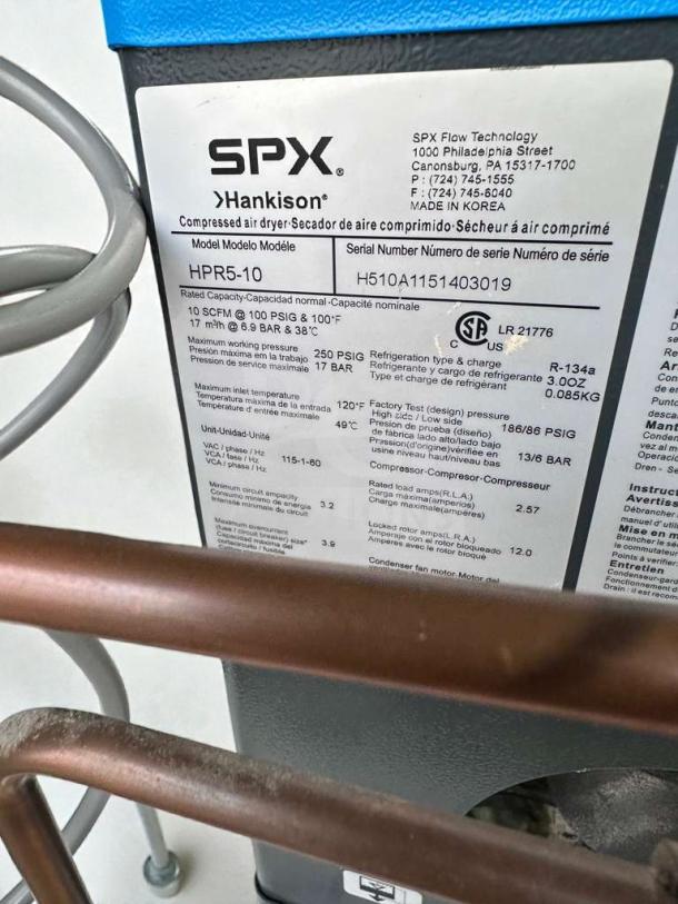 Powerex oil-less scroll air compressor with SPX Hankison HPR5-10 air dryer, 115V. Label shows model, serial, and specs.
