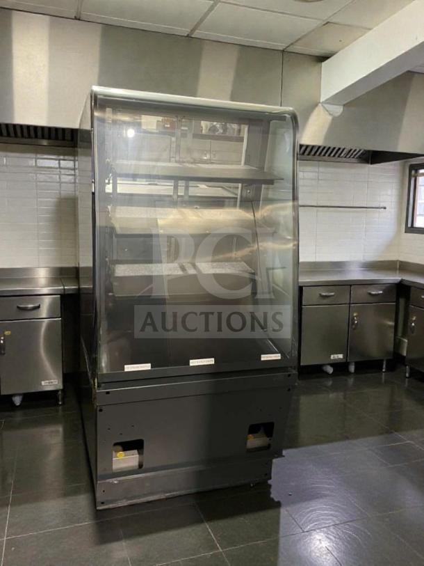 Structural Concepts SB2755 refrigerated bakery display case, premium condition, 220V, single phase, glass front, black base.