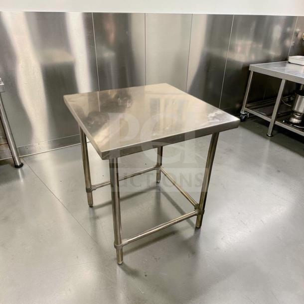 Stainless steel commercial prep table in superb condition, heavy-duty, square top, polished finish, fully inspected.