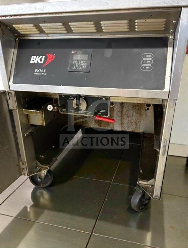 BKI FKM-F 75 lb commercial electric pressure fryer, fully tested, top-tier condition, features control panel, red knob, on wheels.