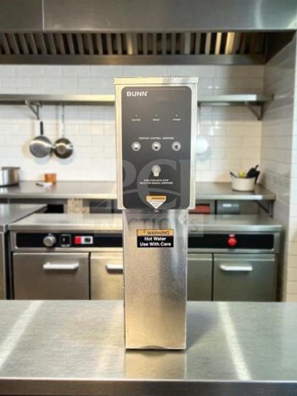 BUNN H5E-DV PC 5-gallon hot water dispenser, stainless steel, excellent condition, dual voltage, warning label visible.