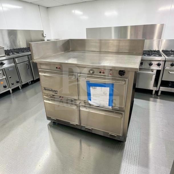 Alt text: Duke Thermotainer Heated Holding Cabinet in excellent condition, 208V/3 phase, fully tested, with visible controls and Thermotainer branding.