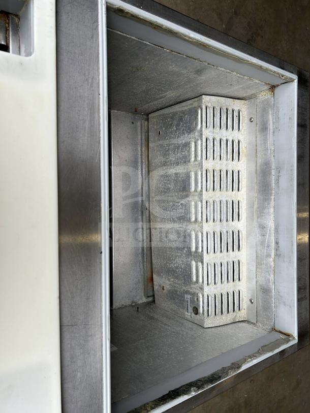 Continental SW27-12M refrigerated sandwich prep unit interior, 27" wide, 7.4 cu. ft., stainless steel, UL & NSF listed.