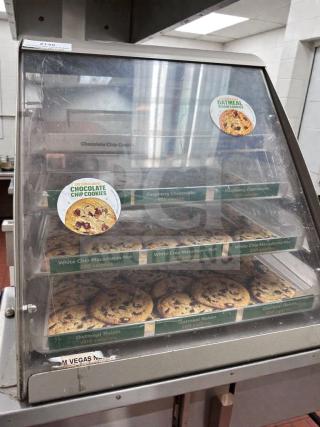 Commercial countertop multi-tier bakery display case, exceptional condition, fully tested, clear glass, cookie labels visible.