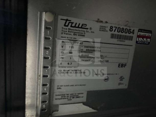 True TPP-93 commercial pizza prep table label, pristine condition, 93", 3-door, cutting board top, model details visible.
