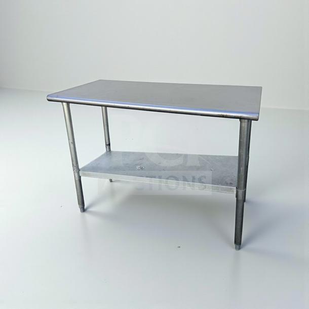 Commercial stainless steel work table, 48"x24", with undershelf, NSF certified, refined condition, ready for use.