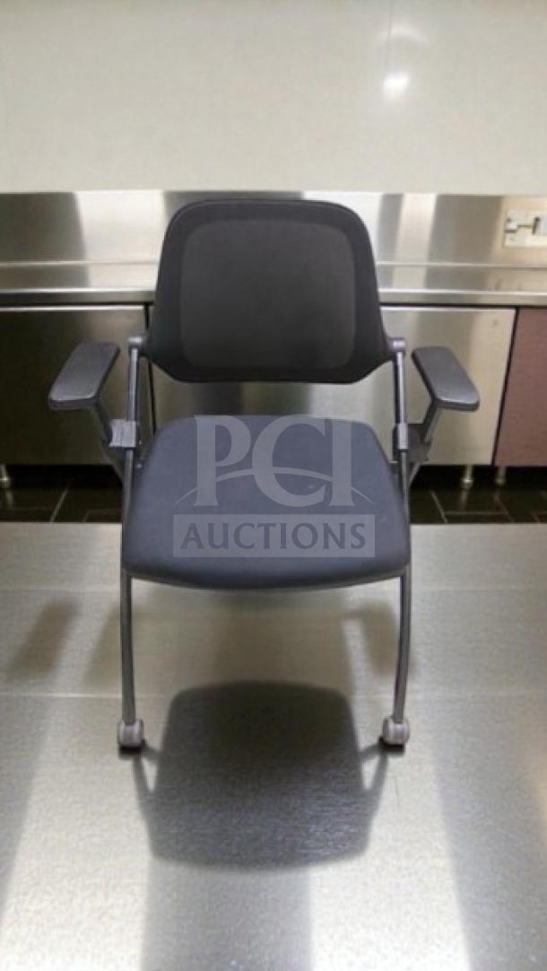 Commercial Institutional Furniture stackable training chair with arms, sled base, inspected and ready for use.