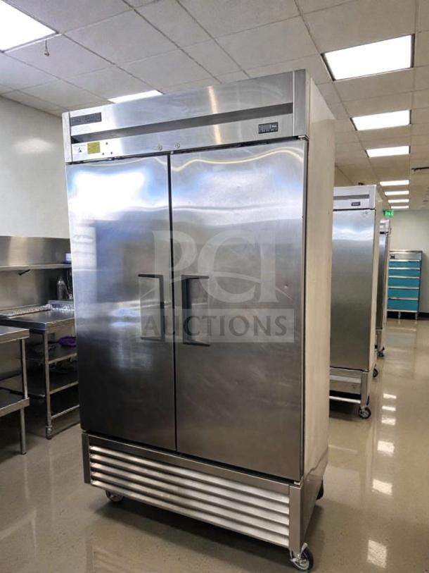Commercial two-door reach-in refrigerator, stainless steel, bottom-mount, immaculate condition, fully tested and operational.