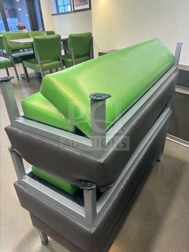 Commercial grade restaurant booth seating, superb condition, with green upholstered vinyl cushions and a heavy-duty metal frame.