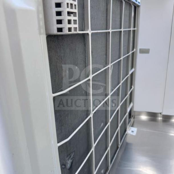 Fujitsu AUU24RLB 24,000 BTU commercial outdoor condenser unit. Fully operational, elite condition, model label visible.