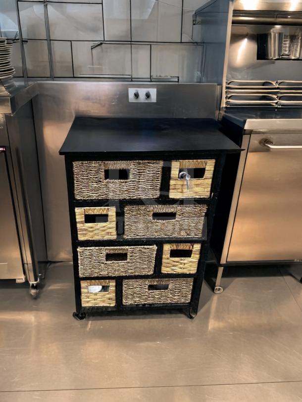 Woven basket storage cabinet with multiple drawers, black frame, compact size, excellent condition, fully functional.