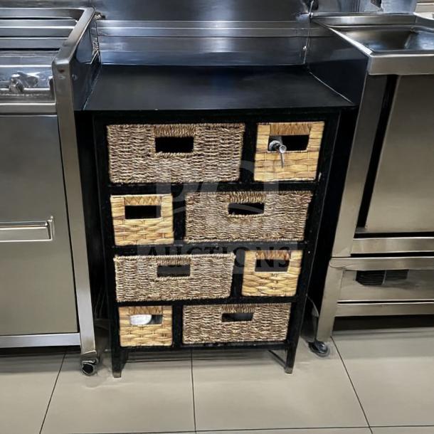 Compact storage cabinet with woven basket drawers, black frame, and multiple compartments. Remarkable condition, functional.