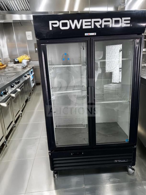 True GDM-43EM commercial glass door refrigerator, two-door merchandiser in excellent condition, branded "Powerade," tested, and operational.