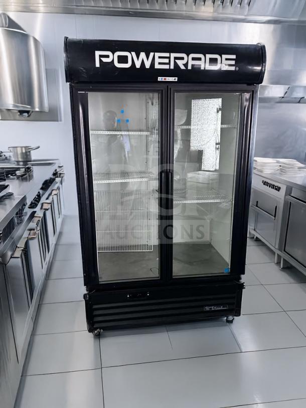 True GDM-43EM glass door merchandiser refrigerator, 2 doors, excellent condition, 115V, fully operational, "Powerade" branding.