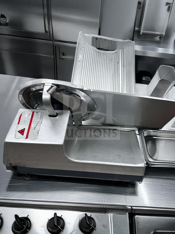 Pristine Bizerba GSP HD meat slicer, heavy-duty precision, 120V, fully operational; metallic finish, safety labels visible.