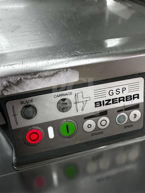 Bizerba GSP HD commercial automatic meat slicer controls, pristine condition, shows on/off buttons and branding.