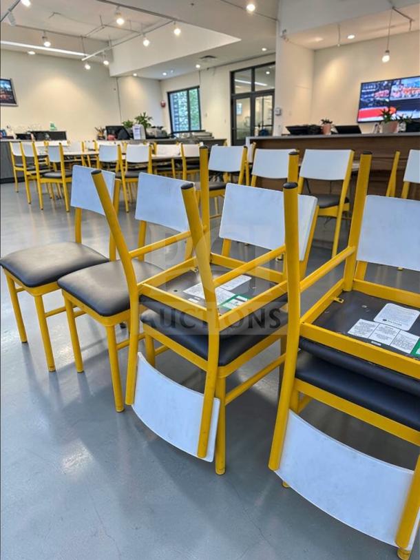 Commercial grade dining chairs with upholstered seat and back, heavy-duty metal frame in yellow, inspected and ready for use.