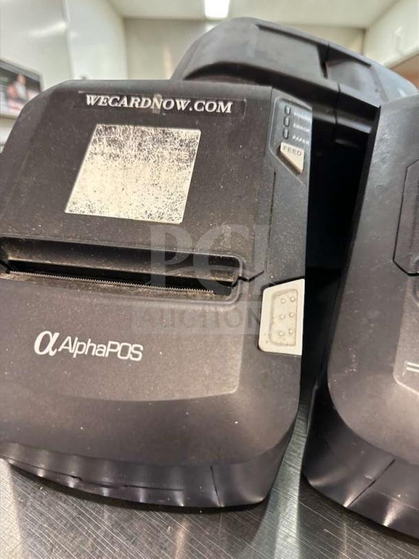 AlphaPOS thermal receipt printer in high-grade condition, USB interface, fully tested. Visible "WECARDNOW.COM" mark, model POS-S-PRT-0599.
