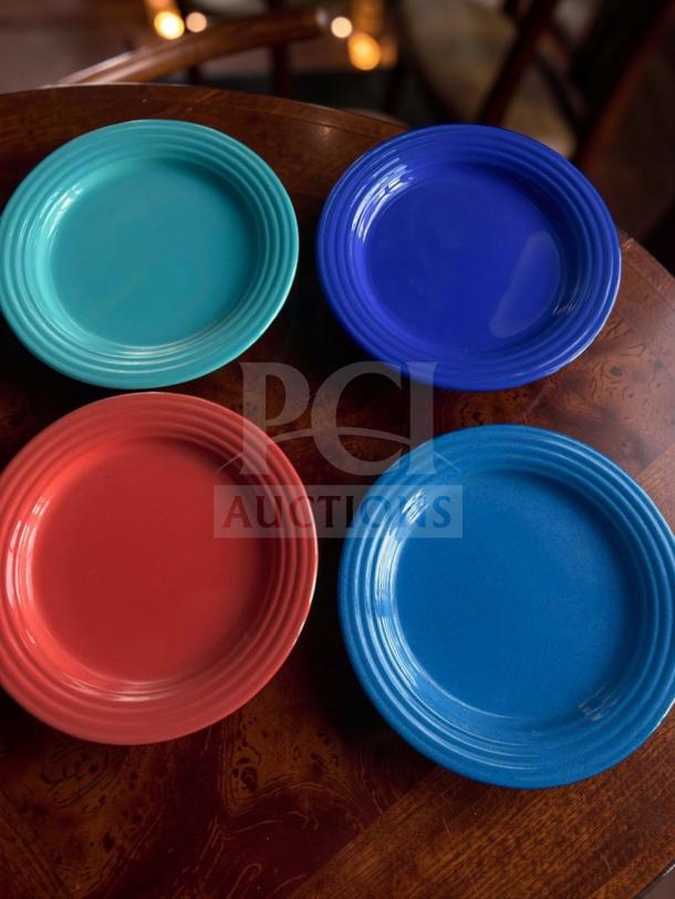 Assorted stoneware plates in turquoise, blue, and red, exceptional condition, by Commercial Restaurant Tableware, set of 188.