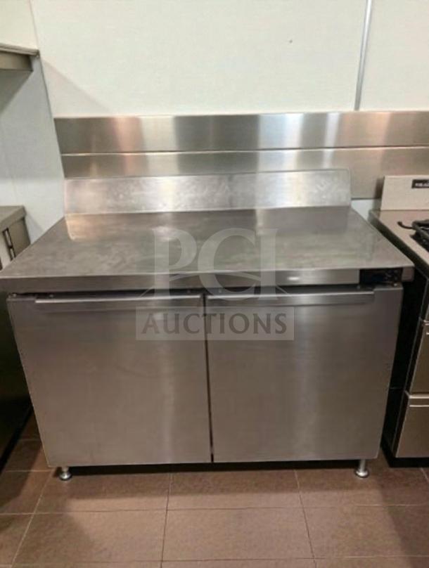 Prime condition Continental 2-door undercounter prep table refrigerator; stainless steel, fully tested, operational.