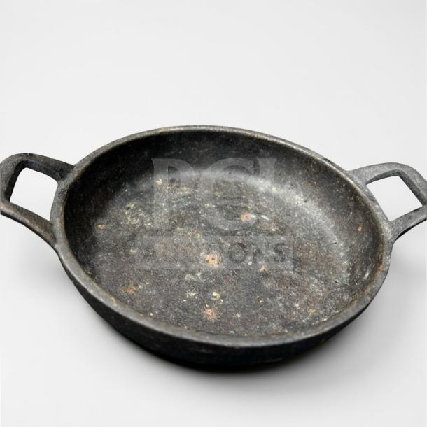 Commercial cast iron mini skillet with dual handles; heavy-duty condition; ideal for restaurant use; set of 2.