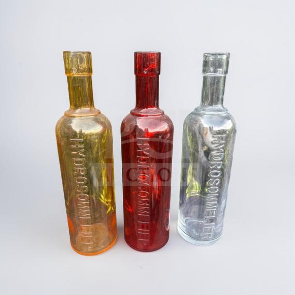 HydroSommelier embossed glass water bottles in orange, red, and clear. Exceptional condition, commercial grade.